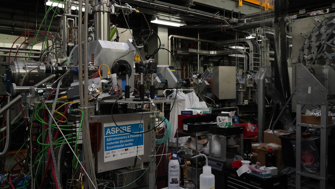 Complex laboratory with pipes, wires, and scientific equipment.